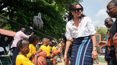 Meghan Markle, center, Speaks with a woman during the Giant of Africa Foundation at the Dream Big Basketball clinic in Lagos Nigeria, Sunday, May 12, 2024. Prince Harry and his wife Meghan are in Nigeria to champion the Invictus Games, which Prince Harry founded to aid the rehabilitation of wounded and sick servicemembers and veterans. (AP Photo/Sunday Alamba) (AP) Meghan Markle, center, Speaks with a woman during the Giant of Africa Foundation at the Dream Big Basketball clinic in Lagos Nigeria, Sunday, May 12, 2024. Prince Harry and his wife Meghan are in Nigeria to champion the Invictus Games, which Prince Harry founded to aid the rehabilitation of wounded and sick servicemembers and veterans. (AP Photo/Sunday Alamba) (AP)