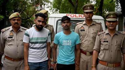 Police arrested the suspects while they were riding a stolen Hero Splendor Plus motorcycle in front of Pushta Road, Raipur village. (Sunil Ghosh/HT Photo) Police arrested the suspects while they were riding a stolen Hero Splendor Plus motorcycle in front of Pushta Road, Raipur village. (Sunil Ghosh/HT Photo)