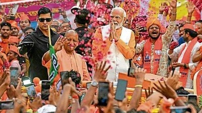 Prime Minister Narendra Modi and chief minister Yogi Adityanath during a road show in Varanasi on May 13. (AFP File Photo) Prime Minister Narendra Modi and chief minister Yogi Adityanath during a road show in Varanasi on May 13. (AFP File Photo)