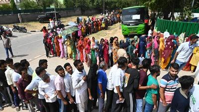 Voters queue up to exercise their franchise at a polling booth in the EWS Colony at Maloya in Chandigarh on Saturday. (Keshav Singh/HT) Voters queue up to exercise their franchise at a polling booth in the EWS Colony at Maloya in Chandigarh on Saturday. (Keshav Singh/HT)
