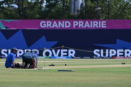 Two people adjust remote cameras near the wickets the day before the first match of the T20 World Cup at Grand Prairie Stadium in Grand Prairie, Texas on May 31, 2024. The USA make their debut in the T20 World Cup against Canada on June 1. (AFP) Two people adjust remote cameras near the wickets the day before the first match of the T20 World Cup at Grand Prairie Stadium in Grand Prairie, Texas on May 31, 2024. The USA make their debut in the T20 World Cup against Canada on June 1. (AFP)