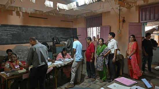 Lok Sabha election: Voters queue up to cast their ballots at a polling station during voting in Maharashtra Lok Sabha election: Voters queue up to cast their ballots at a polling station during voting in Maharashtra