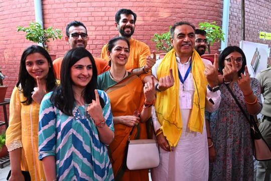 BJP candidate Sanjay Tandon with family members after voting at the polling station in Sector 18, Chandigarh, on Saturday. (Keshav Singh/HT) BJP candidate Sanjay Tandon with family members after voting at the polling station in Sector 18, Chandigarh, on Saturday. (Keshav Singh/HT)