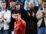 Serbia's Novak Djokovic celebrates winning his third round match 