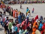 Voters queue up to cast their ballots at a polling station during the seventh and final phase of voting in India's general election in Chandigarh on June 1, 2024. (Photo by AFP)