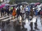 Pedestrians hold umbrellas as they cross a street amid rains, in Kochi, Wednesday, May 29, 2024. Pedestrians hold umbrellas as they cross a street amid rains, in Kochi, Wednesday, May 29, 2024.