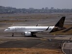 A Vistara passenger aircraft taxis on the tarmac at Chhatrapati Shivaji International Airport in Mumbai, India.