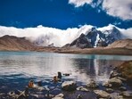 Gurudongmar, Sikkim: Gurudongmar Lake is one of the highest lakes in the world, located at an altitude of 17,800 feet in North Sikkim. The lake is named after Guru Padmasambhava and is considered sacred by both Buddhists and Sikhs. Surrounded by snow-capped mountains, including the majestic Kanchenjunga, the lake offers stunning views of the Himalayan landscape. The clear blue waters of the lake are a sight to behold, reflecting the beauty of the surrounding peaks.&nbsp;(Unsplash)