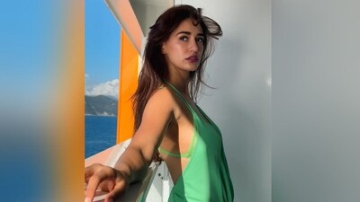 Her dewy make-up look features nude eyeshadow, mascaraed lashes, defined brows, a swipe of kohl, dewy base, contoured cheekbones with a hint of blush, luminous highlighter and a shade of ruby red lipstick. (Instagram/@dishapatani) Her dewy make-up look features nude eyeshadow, mascaraed lashes, defined brows, a swipe of kohl, dewy base, contoured cheekbones with a hint of blush, luminous highlighter and a shade of ruby red lipstick. (Instagram/@dishapatani)