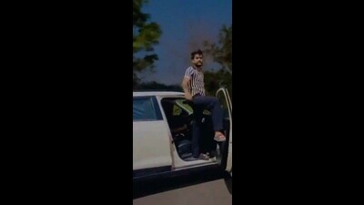 A 24-second video was doing the rounds on social media platforms since Saturday night, showing the driver of an SUV climbed up on the roof to pose while the car is moving at speed. (HT Photo) A 24-second video was doing the rounds on social media platforms since Saturday night, showing the driver of an SUV climbed up on the roof to pose while the car is moving at speed. (HT Photo)