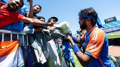 Hardik Pandya sign autographs to attendees during a warm-up cricket match between Bangladesh and India at the Nassau County International Cricket Stadium, (AP) Hardik Pandya sign autographs to attendees during a warm-up cricket match between Bangladesh and India at the Nassau County International Cricket Stadium, (AP)