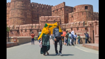 People at the Agra Fort on a hot summer day, in Agra, Sunday (PTI)