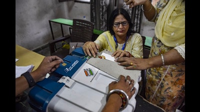 Polling officials seal an electronic voting machine in Jalandhar. (PTI)