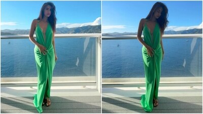 Her outfit comes in an enchanting shade of green and features a halterneck, deep plunging neckline and ultra-sexy open back silhouette in slinky crepe that ties at the hip for an effortless drape. The centre slit adds an extra touch of flair. (Instagram/@dishapatani) Her outfit comes in an enchanting shade of green and features a halterneck, deep plunging neckline and ultra-sexy open back silhouette in slinky crepe that ties at the hip for an effortless drape. The centre slit adds an extra touch of flair. (Instagram/@dishapatani)