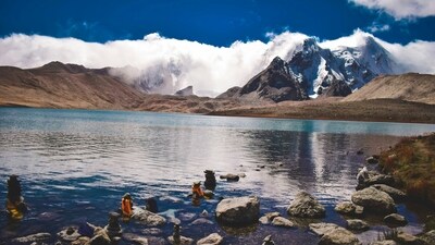 Gurudongmar, Sikkim: Gurudongmar Lake is one of the highest lakes in the world, located at an altitude of 17,800 feet in North Sikkim. The lake is named after Guru Padmasambhava and is considered sacred by both Buddhists and Sikhs. Surrounded by snow-capped mountains, including the majestic Kanchenjunga, the lake offers stunning views of the Himalayan landscape. The clear blue waters of the lake are a sight to behold, reflecting the beauty of the surrounding peaks. (Unsplash) Gurudongmar, Sikkim: Gurudongmar Lake is one of the highest lakes in the world, located at an altitude of 17,800 feet in North Sikkim. The lake is named after Guru Padmasambhava and is considered sacred by both Buddhists and Sikhs. Surrounded by snow-capped mountains, including the majestic Kanchenjunga, the lake offers stunning views of the Himalayan landscape. The clear blue waters of the lake are a sight to behold, reflecting the beauty of the surrounding peaks. (Unsplash)