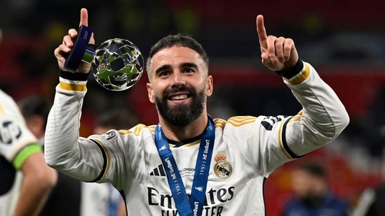 Real Madrid's Spanish defender #02 Dani Carvajal celebrates the victory at the end of the UEFA Champions League final football match (AFP)