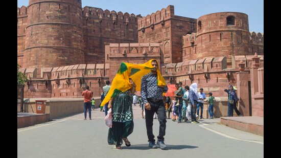 People at the Agra Fort on a hot summer day, in Agra, Sunday (PTI)