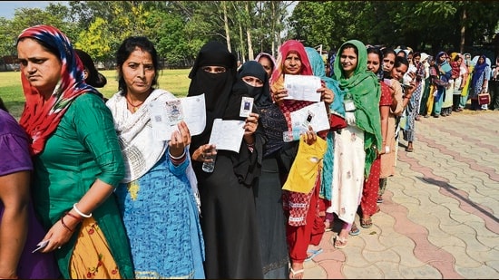 Women voters queued up at a polling booth in Dhanas, Chandigarh, on Saturday. (Keshav Singh/HT)