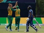 South Africa's Anrich Nortje, left, celebrates with a teammate after the dismissal of Sri Lanka's Kusal Mendis South Africa's Anrich Nortje, left, celebrates with a teammate after the dismissal of Sri Lanka's Kusal Mendis