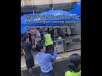 Snapshot of the staff standing with umbrellas. Snapshot of the staff standing with umbrellas.