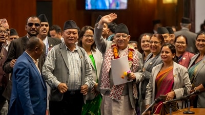 Nepalese Prime Minister Pushpa Kamal Dahal waves to media after winning a vote of confidence in parliament in Kathmandu, Nepal, Monday, May 20, 2024. Dahal will continue leading his shaky governing coalition after winning his fourth vote of confidence in two years on Monday. (AP/PTI)(AP05_20_2024_000230B) (AP) Nepalese Prime Minister Pushpa Kamal Dahal waves to media after winning a vote of confidence in parliament in Kathmandu, Nepal, Monday, May 20, 2024. Dahal will continue leading his shaky governing coalition after winning his fourth vote of confidence in two years on Monday. (AP/PTI)(AP05_20_2024_000230B) (AP)