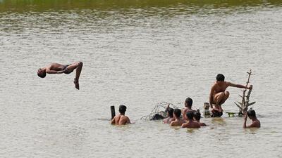 Children cool off in a pond at the Yamuna floodplains. (Vipin Kumar/HT Photo) Children cool off in a pond at the Yamuna floodplains. (Vipin Kumar/HT Photo)