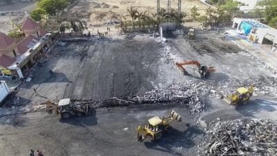 Debris being removed from the game zone site where a fire broke out on Saturday, in Rajkot on May 27. (PTI) Debris being removed from the game zone site where a fire broke out on Saturday, in Rajkot on May 27. (PTI)