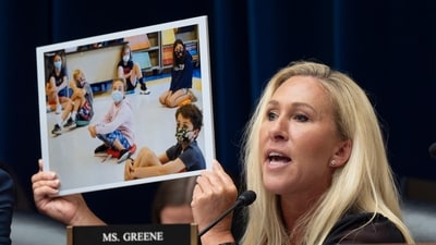 Rep. Marjorie Taylor Greene, R-Ga., holds up a photo as she condemns Dr. Anthony Fauci, the former Director of the National Institute of Allergy and Infectious Diseases, during his testimony before the House Oversight and Accountability Committee Select Subcommittee on the Coronavirus Pandemic, at the Capitol in Washington, Monday, June 3, 2024. (AP Photo/J. Scott Applewhite) (AP) Rep. Marjorie Taylor Greene, R-Ga., holds up a photo as she condemns Dr. Anthony Fauci, the former Director of the National Institute of Allergy and Infectious Diseases, during his testimony before the House Oversight and Accountability Committee Select Subcommittee on the Coronavirus Pandemic, at the Capitol in Washington, Monday, June 3, 2024. (AP Photo/J. Scott Applewhite) (AP)