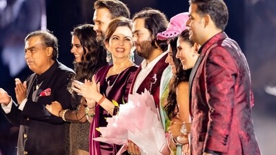 Mukesh Ambani, Isha Ambani, Anand Piramal, Nita Ambani, Anant Ambani, Rihanna, Radhika Merchant, Shloka Mehta Ambani and Akash Ambani during pre-wedding celebrations of Anant and Radhika in Jamnagar, Gujarat in March. (Reuters)