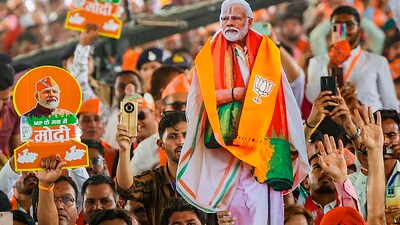 Stock market: BJP supporters during a public meeting of Prime Minister Narendra Modi for Lok Sabha elections, in Dhar, Madhya Pradesh. (PTI) Stock market: BJP supporters during a public meeting of Prime Minister Narendra Modi for Lok Sabha elections, in Dhar, Madhya Pradesh. (PTI)