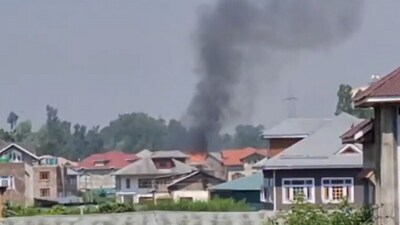 A video shared by news agency ANI captured the visuals of smoke emanating from the trapped house. (ANI)