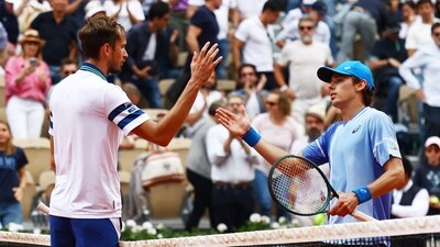 Australia's Alex de Minaur shakes hands with Russia's Daniil Medvedev after winning their fourth round match (REUTERS)