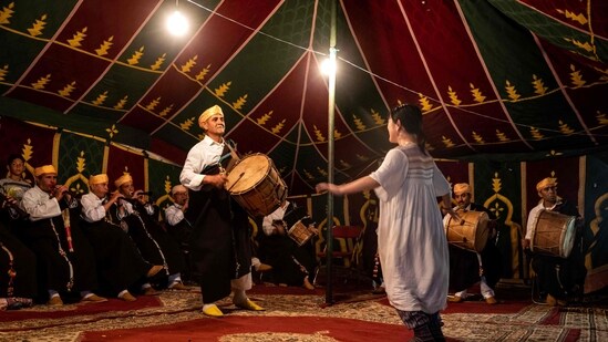 The Master Musicians of Joujouka group performs during the annual Joujouka Musical Festival in northern Morocco's Jajouka village. (Photo by FADEL SENNA / AFP)