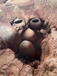 Burial urns dated to 1400 BCE have been found at the megalithic site of Adichanallur, on the banks of the Thamirabarani river (below). The remains represent a range of races; perhaps this was a burial ground for foreigners? (Photo by Mridula Ramesh) Burial urns dated to 1400 BCE have been found at the megalithic site of Adichanallur, on the banks of the Thamirabarani river (below). The remains represent a range of races; perhaps this was a burial ground for foreigners? (Photo by Mridula Ramesh)