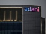 The logo of the Adani Group is seen on the facade of one of its buildings on the outskirts of Ahmedabad.