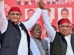 Samajwadi Party (SP ) chief Akhilesh Yadav holds hands with party candidate from Faizabad Lok Sabha constituency, Awadhesh Prasad. Samajwadi Party (SP ) chief Akhilesh Yadav holds hands with party candidate from Faizabad Lok Sabha constituency, Awadhesh Prasad.