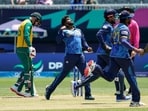 Sri Lanka's captain Wanindu Hasaranga (2nd L) celebrates after the dismissal of South Africa's Heinrich Klaasen (L) during the ICC men's Twenty20 World Cup 2024 group D cricket match between Sri Lanka and South Africa at Nassau County International Cricket Stadium