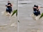 The heartbreaking image shows three friends hugging each other moments before being swept away by floodwaters. 