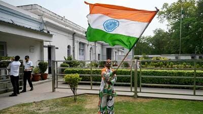 A Congress supporter at the party headquarters in Delhi. (AFP) A Congress supporter at the party headquarters in Delhi. (AFP)