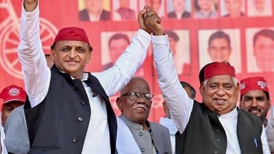 Samajwadi Party (SP ) chief Akhilesh Yadav holds hands with party candidate from Faizabad Lok Sabha constituency, Awadhesh Prasad. (File photo) Samajwadi Party (SP ) chief Akhilesh Yadav holds hands with party candidate from Faizabad Lok Sabha constituency, Awadhesh Prasad. (File photo)