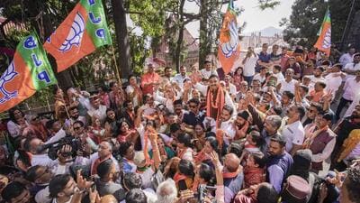 BJP candidate from Shimla constituency Suresh Kashyap celebrates with party workers as he leads during counting of votes for Lok Sabha elections in Shimla on Tuesday. (PTI) BJP candidate from Shimla constituency Suresh Kashyap celebrates with party workers as he leads during counting of votes for Lok Sabha elections in Shimla on Tuesday. (PTI)
