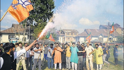 BJP supporters celebrate the party's lead during counting of votes for Lok Sabha elections in Srinagar on Tuesday. (PTI) BJP supporters celebrate the party's lead during counting of votes for Lok Sabha elections in Srinagar on Tuesday. (PTI)