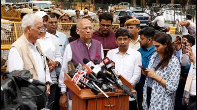 Congress leader Abhishek Manu Singhvi speaking with the media after meeting the ECI officials. (REUTERS)