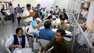 Election officials open an EVM at a counting centre in Ahmedabad (REUTERS)