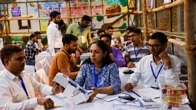 Election officials open an EVM inside a counting centre in Delhi. (REUTERS)