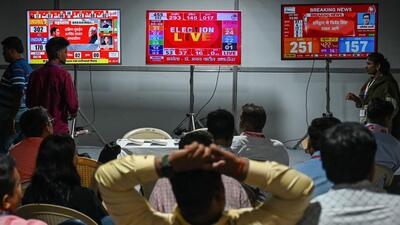 Election results displayed on a television screen in outside a counting centre in Mumbai. (AFP) Election results displayed on a television screen in outside a counting centre in Mumbai. (AFP)