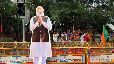 A large cutout portrait of Prime Minister Narendra Modi is placed outside the office of Bharatiya Janata Party (BJP). (AP)