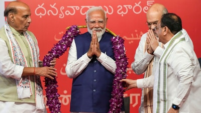 Prime Minister Narendra Modi being garlanded by Union Home Minister Amit Shah, Union Defence Minister Rajnath Singh and BJP National President JP Nadda (PTI) Prime Minister Narendra Modi being garlanded by Union Home Minister Amit Shah, Union Defence Minister Rajnath Singh and BJP National President JP Nadda (PTI)