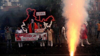 New Delhi: Supporters celebrate during the arrival of Prime Minister Narendra Modi for a meeting at BJP headquarters as the party leads in the Lok Sabha elections amid the counting of votes, in New Delhi, Tuesday, June 4, 2024. (PTI Photo/Manvender Vashist Lav) (PTI06_04_2024_000515A) (PTI) New Delhi: Supporters celebrate during the arrival of Prime Minister Narendra Modi for a meeting at BJP headquarters as the party leads in the Lok Sabha elections amid the counting of votes, in New Delhi, Tuesday, June 4, 2024. (PTI Photo/Manvender Vashist Lav) (PTI06_04_2024_000515A) (PTI)