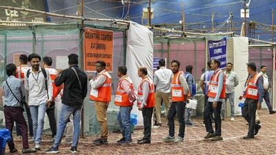Polling officials at a counting centre in Delhi on Tuesday. (PTI)